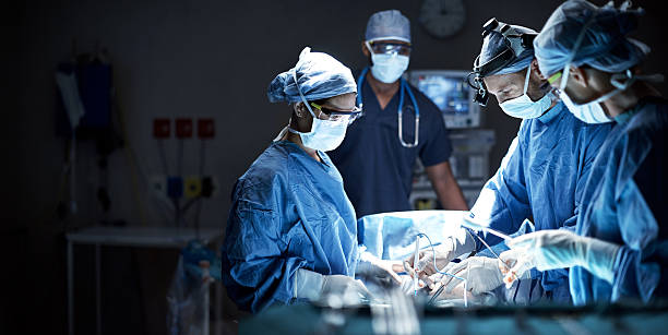 Shot Of A Team Of Surgeons Performing A Surgery In An Operating Room